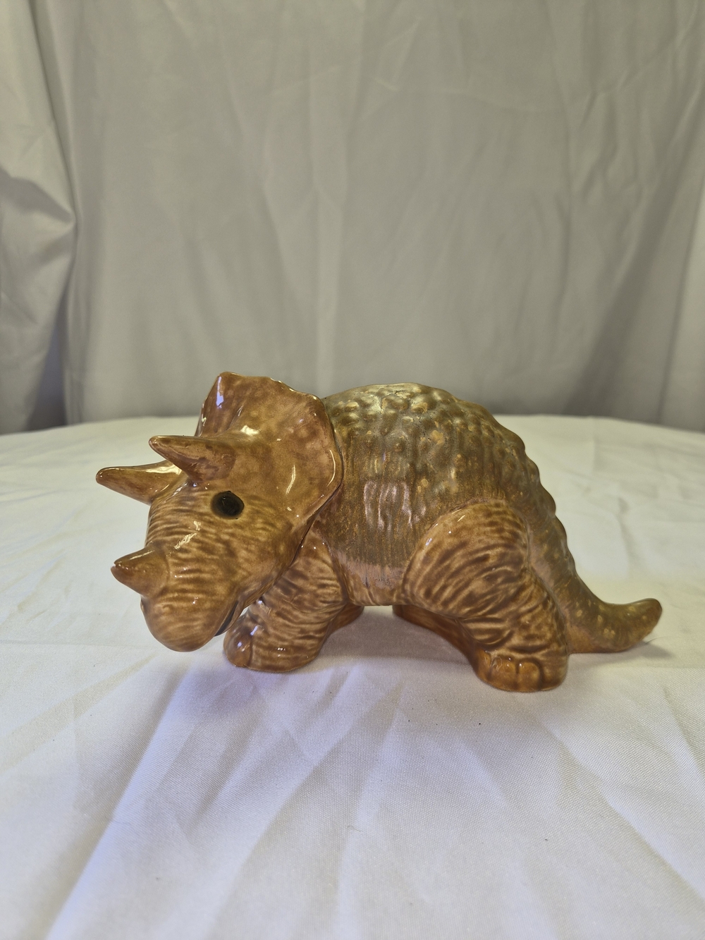 Glazed Ceramic Triceratops Figurine in Warm Brown